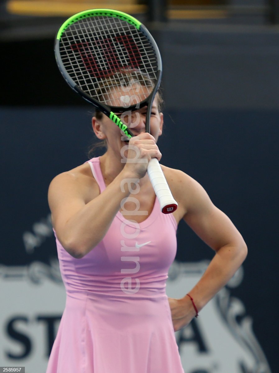 Simona Halep of Romania reacts during an interview with Roger Rashid  against Angelique Kerber of Germany and Robert Farah of Columbia during the  Adelaide International Rally for Resilience exhibition game on day