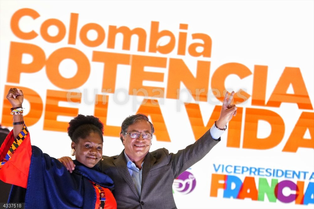 Presidential elections in Colombia 23 March 2022, Colombia, Bogota: Colombian Presidential candidate Gustavo Petro (R) and Vice President candidate Francia Marquez (L) stand in front of an advertising poster with the inscription: "Today Colombia is born great power" during a campign for the Presidential elections, which will be held on 29 May 2022. Photo: Sergio Acero/colprensa/dpa