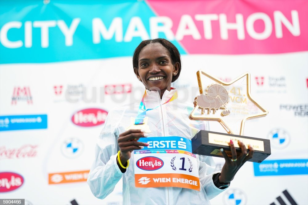 21 April 2024, Austria, Vienna: Eritrea's Nazret Weldu celebrates after winning at the 41st Vienna City Marathon (VCM) in Vienna. Photo: Eva Manhart/APA/dpa