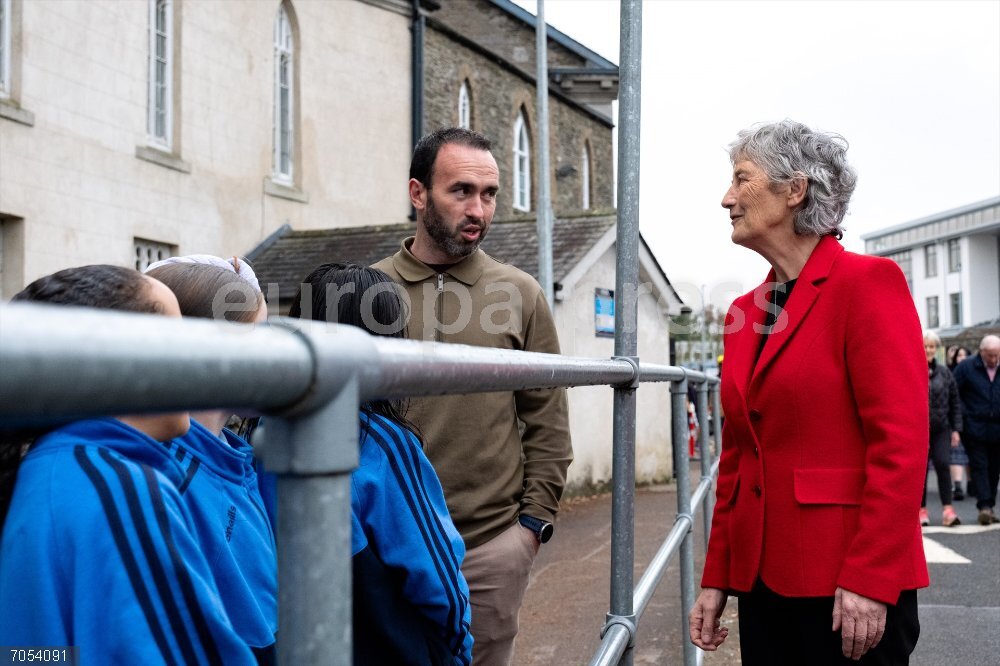 Catherine Connolly Canvassing Naas Presidential 2025 Ireland October 14, 2025, Naas, Kildare, IRELAND: 2025 Irish presidential candidate CATHERINE CONNOLLY (r) talking to teacher and pupils in Naas, County Kildare, Ireland on October 14, 2025. She has met locals on Poplar Square and then headed to Nas Na Riagh Housing Association, McAuley Place.